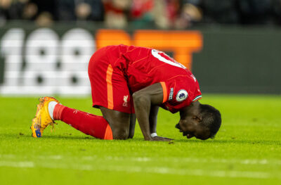 Liverpool's Sadio Mané kneels to pray as he celebrates after scoring the only goal of the game during the FA Premier League match between Liverpool FC and West Ham United FC at Anfield