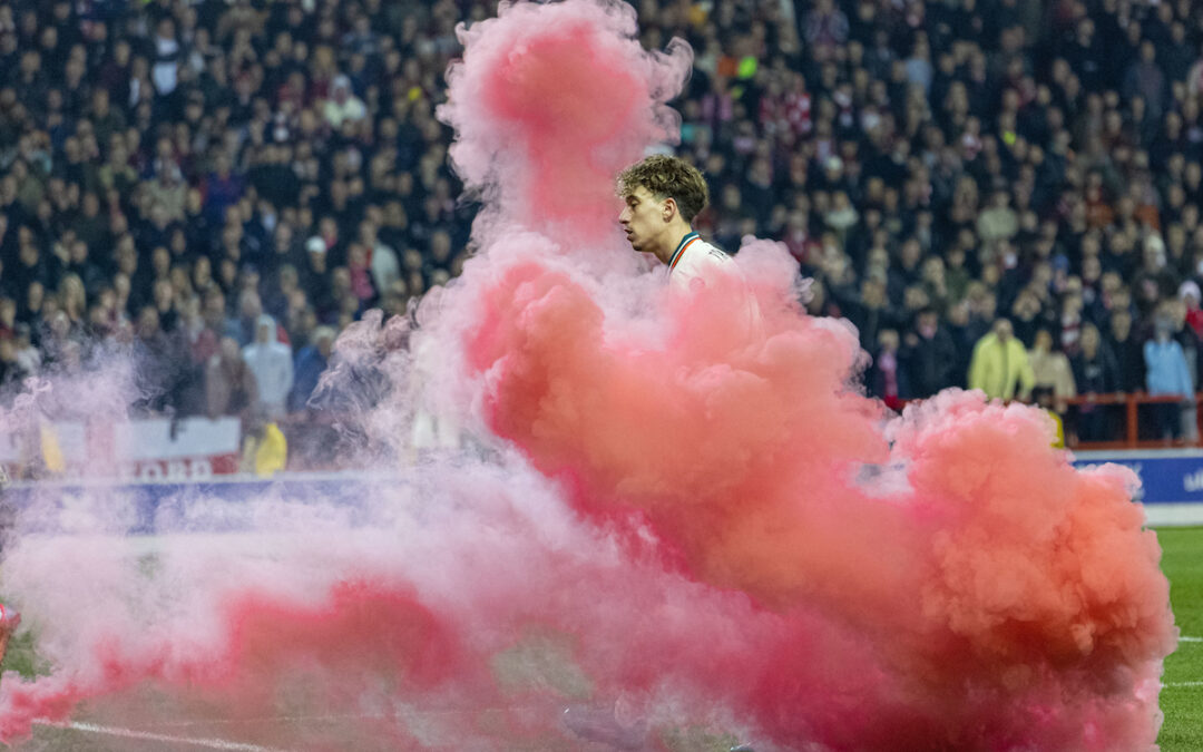 Liverpool's Kostas Tsimikas with a smoke bomb during the FA Cup Quarter-Final match between Nottingham Forest FC and Liverpool FC at the City Ground.