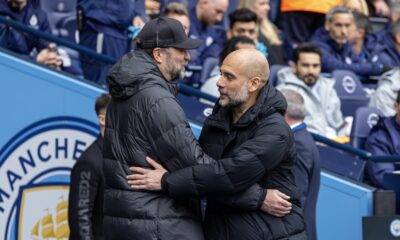 Manchester City's manager Josep 'Pep' Guardiola (R) embraces Liverpool's manager Jürgen Klopp before the FA Premier League match between Manchester City FC and Liverpool FC at the City of Manchester Stadium