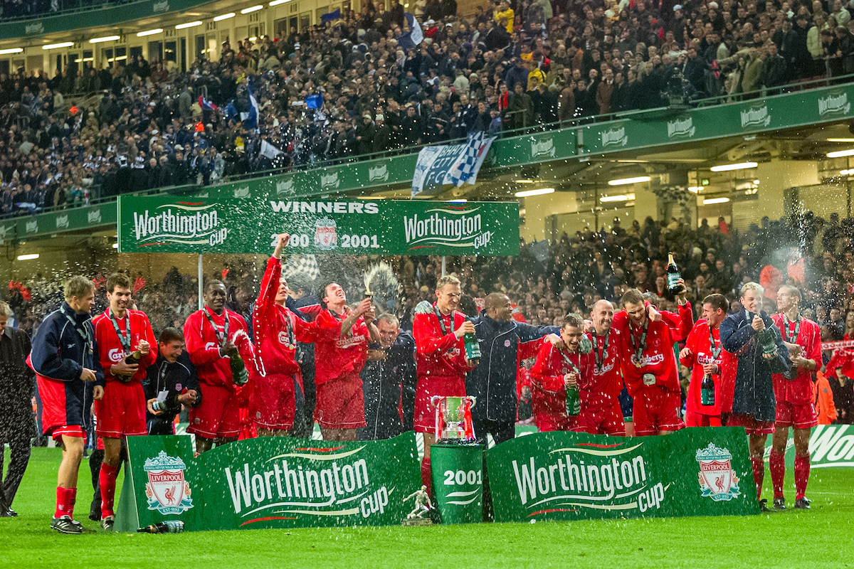 Liverpool players open champagne as they celebrate with the trophy after winning the Football League Cup Final match between Liverpool FC and Birmingham City FC at the Millennium Stadium