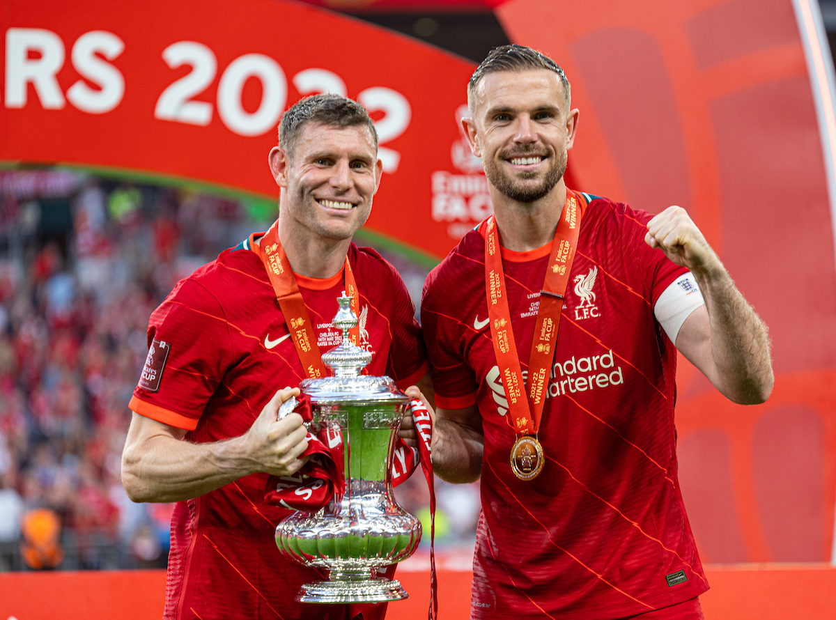 Liverpool's James Milner (L) and captain Jordan Henderson (R) celebrate with the trophy after the FA Cup Final between Chelsea FC and Liverpool FC at Wembley Stadium