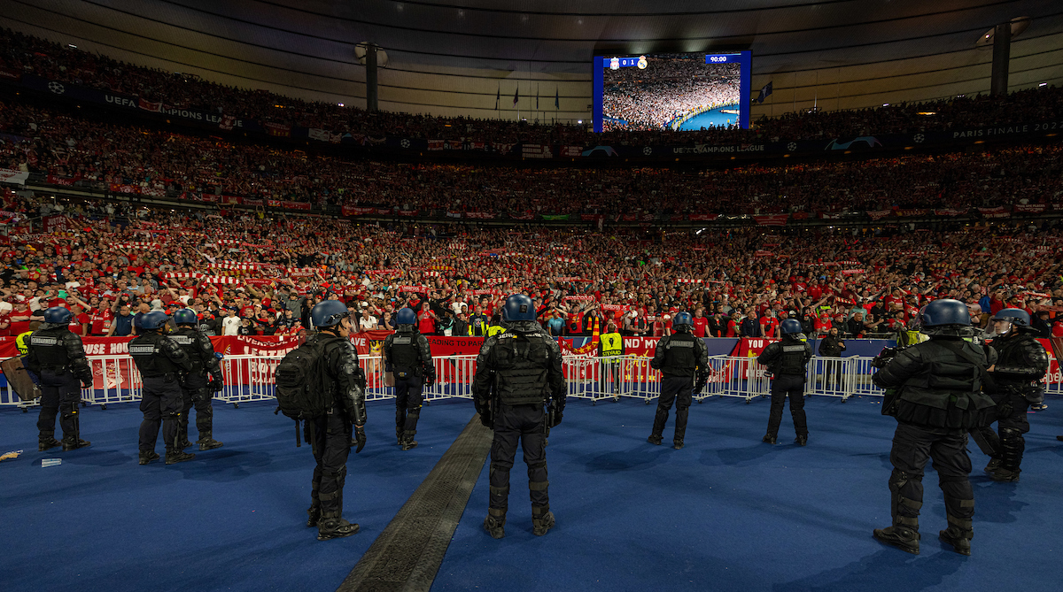 French riot police stand in front of Liverpool supporters wearing body armor and carrying tear gas and guns during the UEFA Champions League Final game between Liverpool FC and Real Madrid CF at the Stade de France