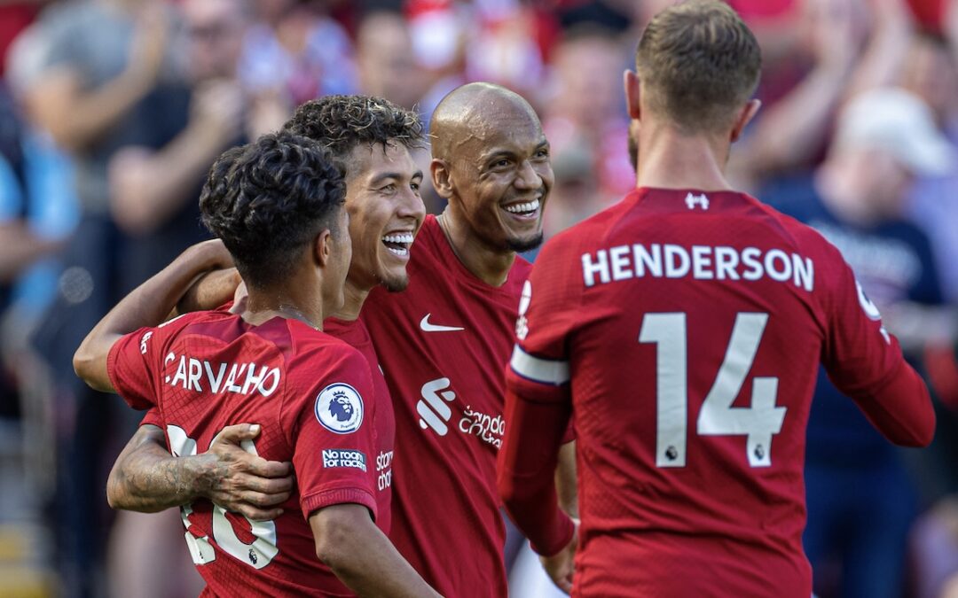 Liverpool's Roberto Firmino (C) celebrates with team-mates Fábio Carvalho (L) and Fabio Henrique Tavares 'Fabinho' (R) after scoring the seventh goal during the FA Premier League match between Liverpool FC and AFC Bournemouth at Anfield