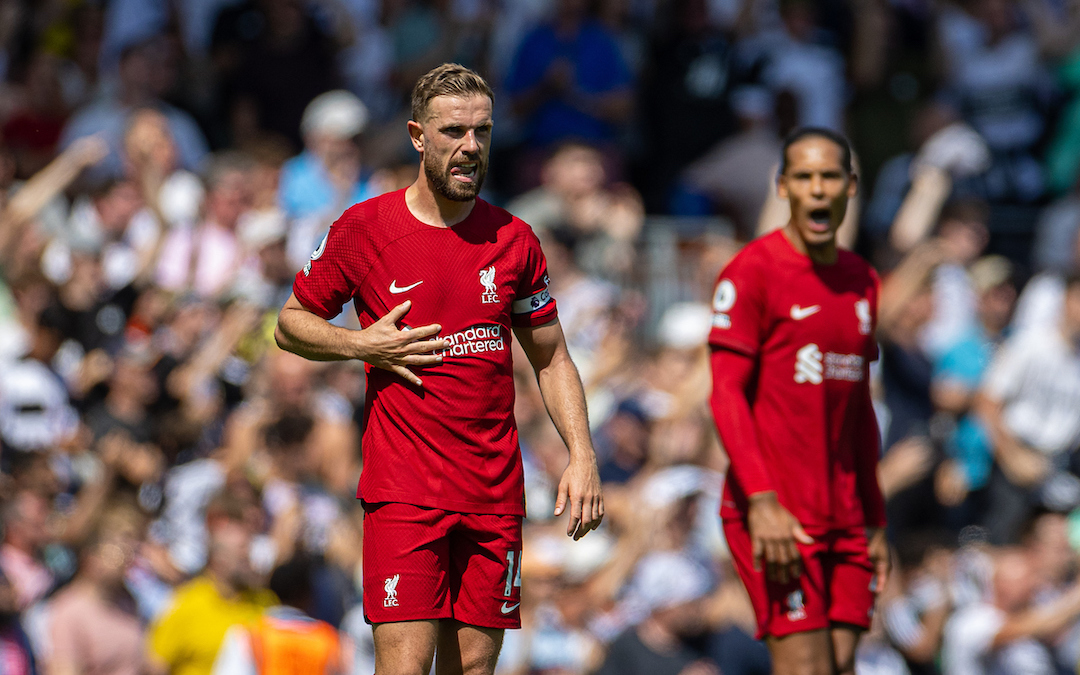 Liverpool's captain Jordan Henderson looks dejected as Fulham score their second goal from a penalty kick during the FA Premier League match between Fulham FC and Liverpool FC at Craven Cottage