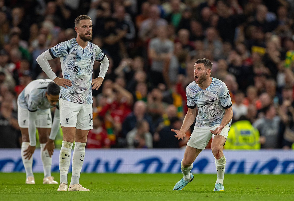 Liverpool's captain Jordan Henderson (L) amd James Milner (R) look dejected as Manchester United score the second goal during the FA Premier League match between Manchester United FC and Liverpool FC at Old Trafford