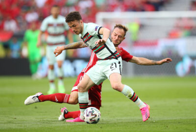 Diogo Jota of Portugal battles for possession with Gergo Lovrencsics of Hungary during the UEFA Euro 2020 Championship Group F match between Hungary and Portugal at Puskas Arena on June 15, 2021 in Budapest, Hungary