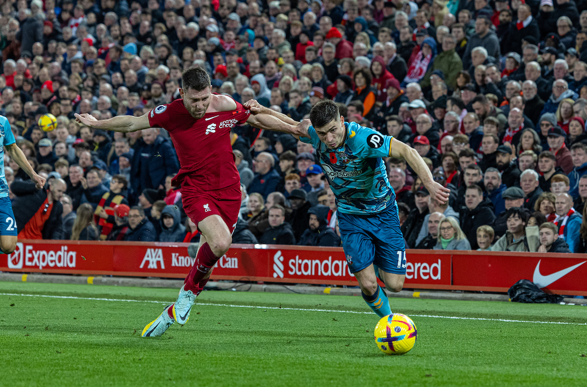 Liverpool's James Milner (L) challenges Southampton's Romain Perraud during the FA Premier League match between Liverpool FC and Southampton FC at Anfield