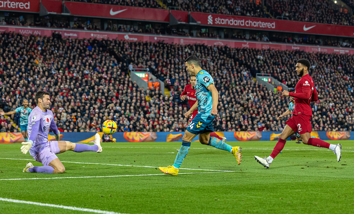 Liverpool's goalkeeper Alisson Becker makes a save from Southampton's Mohamed Elyounoussi during the FA Premier League match between Liverpool FC and Southampton FC at Anfield