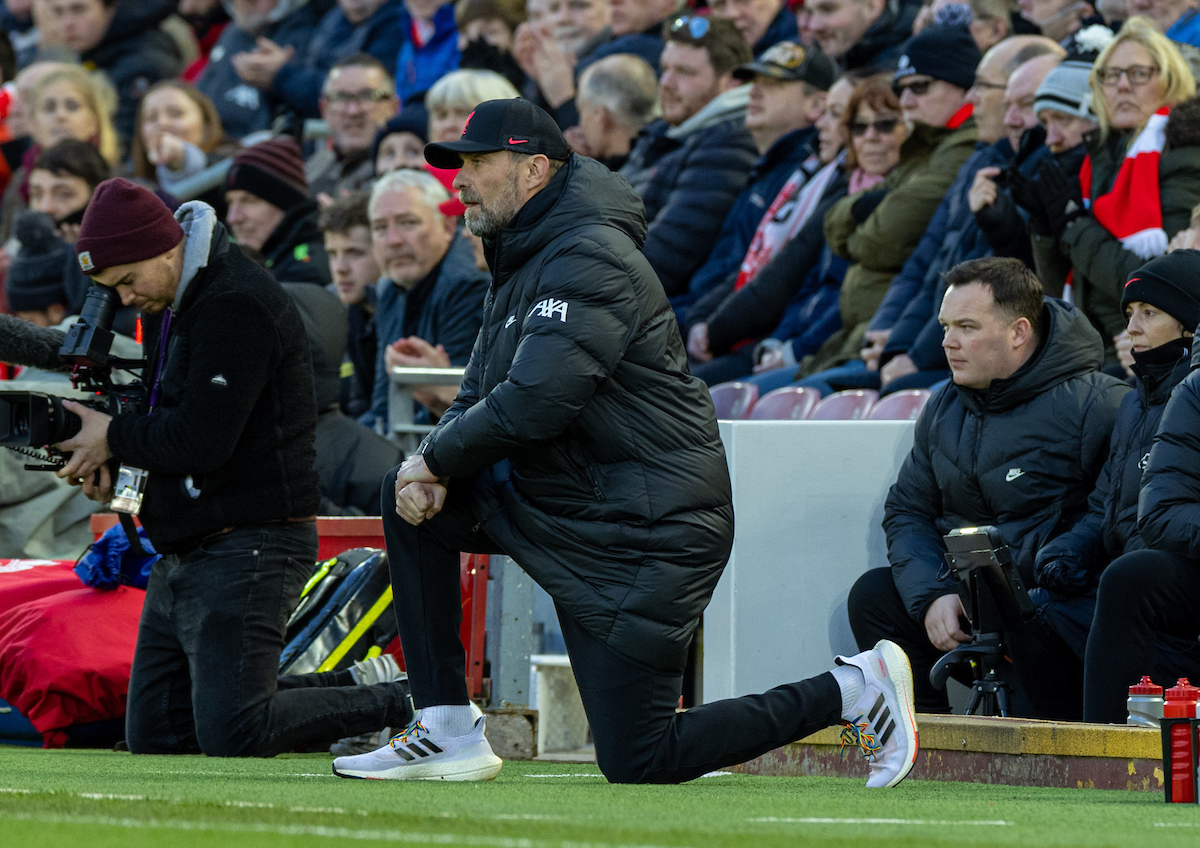 Liverpool's manager Jürgen Klopp kneels down (takes a knee) in support of the Black Lives Matter movement before the FA Premier League match between Liverpool FC and West Ham United FC at Anfield