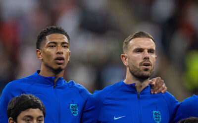 England's Jude Bellingham (L) and Jordan Henderson line-up before the FIFA World Cup Qatar 2022 Round of 16 match between England and Senegal at the Al Bayt Stadium