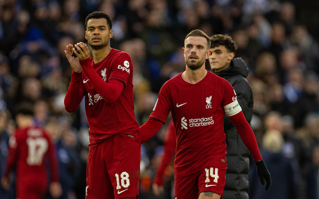 Liverpool's Cody Gakpo (L) applauds the supporters as captain Jordan Henderson looks dejected after the FA Cup 4th Round match between Brighton & Hove Albion FC and Liverpool FC at the Falmer Stadium