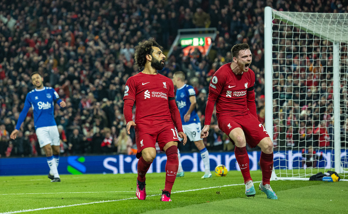 Liverpool's Mohamed Salah (L) celebrates with team-mate Andy Robertson after scoring the opening goal during the FA Premier League match between Liverpool FC and Everton FC, the 242nd Merseyside Derby, at Anfield