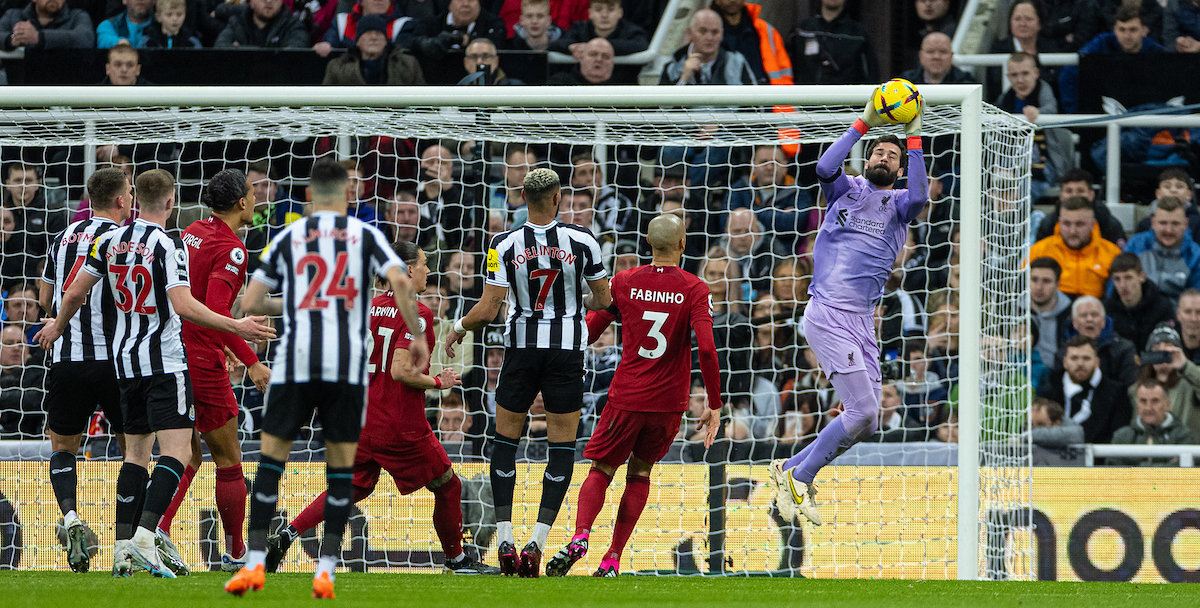 Liverpool's goalkeeper Alisson Becker makes a save during the FA Premier League match between Newcastle United FC and Liverpool FC at St. James' Park