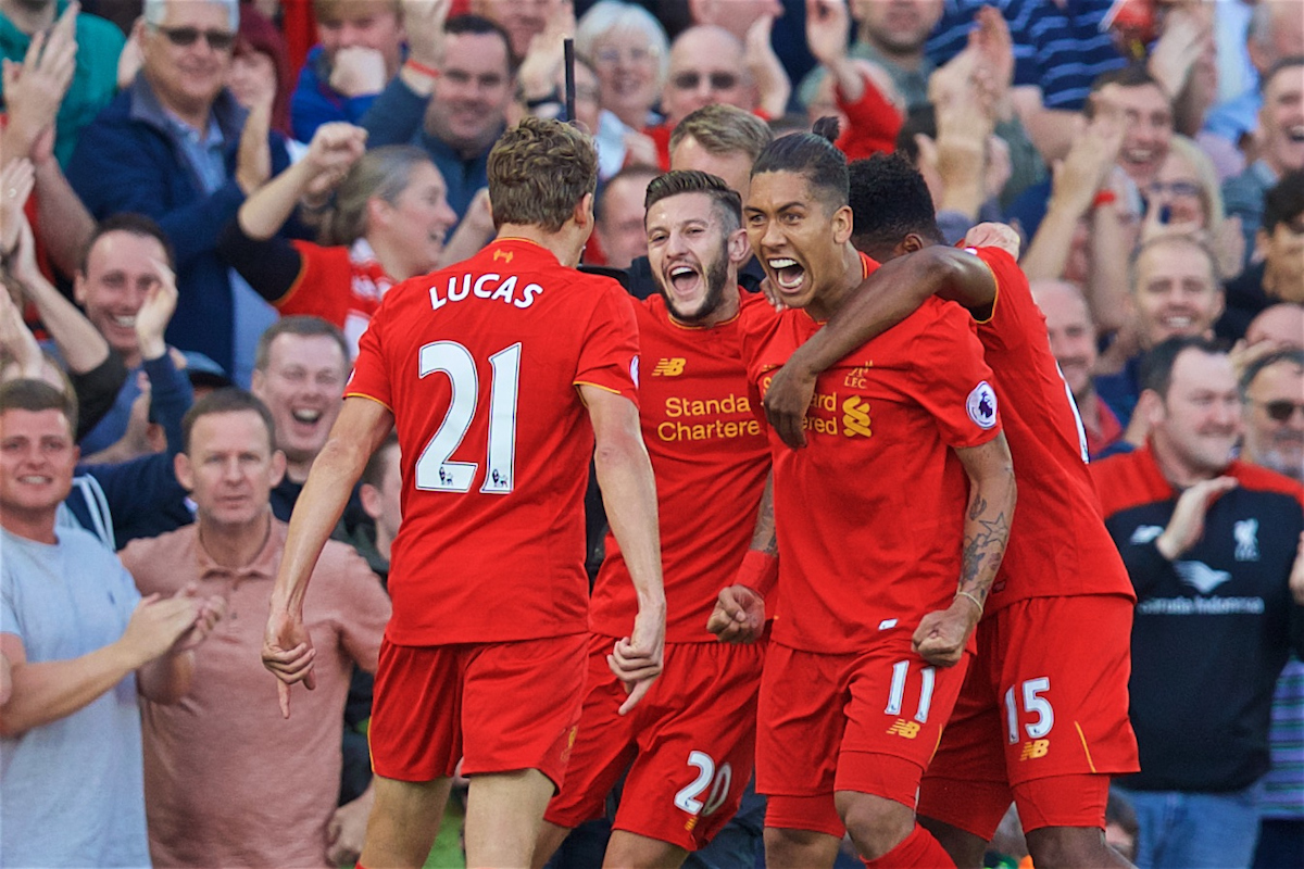 Liverpool's Roberto Firmino celebrates scoring the first goal against Leicester City with team-mates Lucas Leiva and Adam Lallana  during the FA Premier League match at Anfield