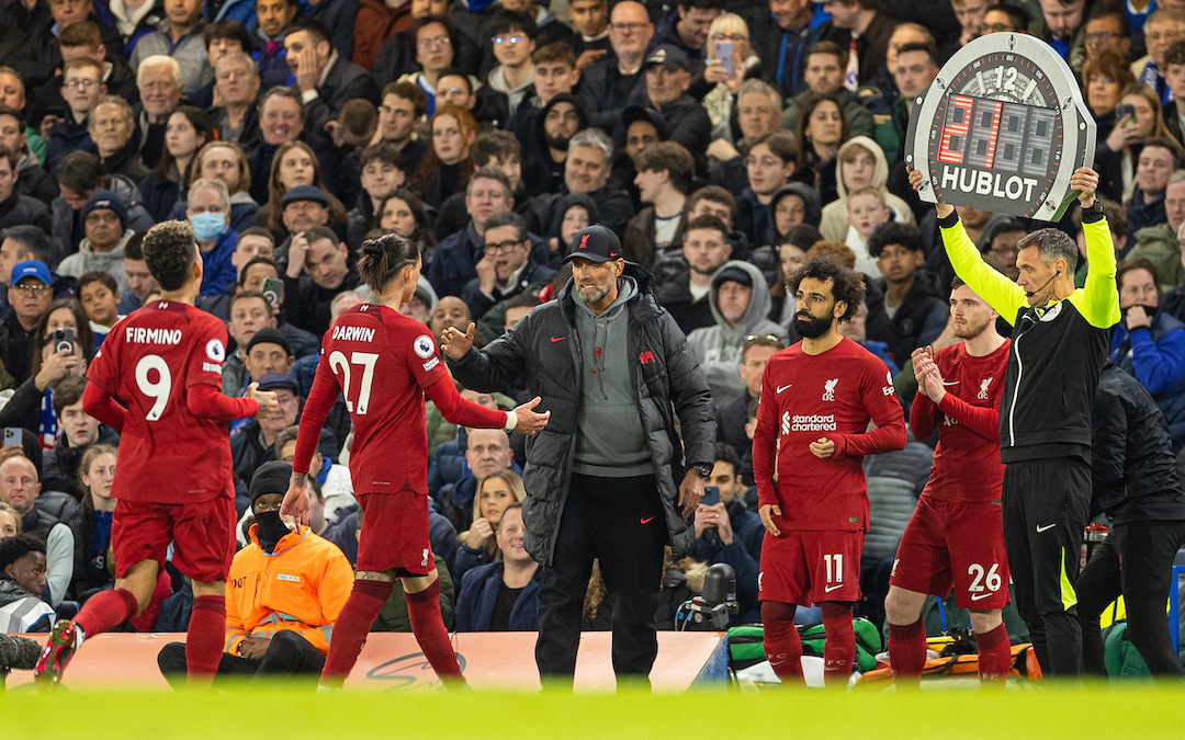Liverpool's manager Jürgen Klopp shakes hands with Darwin Núñez as substitute Mohamed Salah comes on for Roberto Firmino during the FA Premier League match between Chelsea FC and Liverpool FC at Stamford Bridge