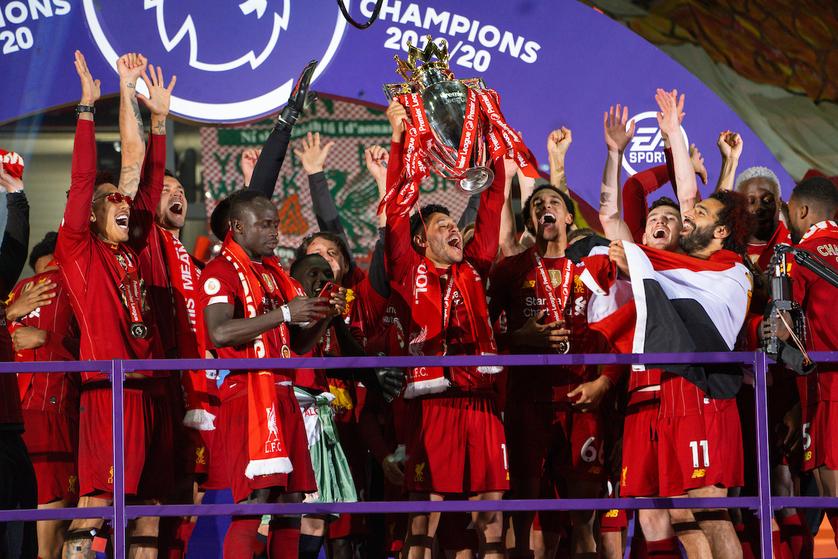 Liverpool’s Alex Oxlade-Chamberlain lifts the Premier League trophy during the presentation as the Reds are crowned Champions after the FA Premier League match between Liverpool FC and Chelsea FC at Anfield