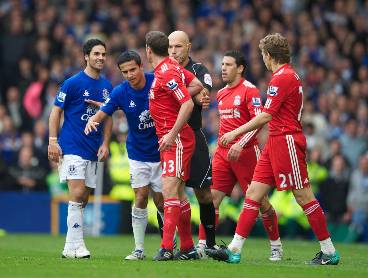 Liverpool's Jamie Carragher clashes with Everton's Mikel Arteta and Tim Cahill tries to diffuse the situation during the 214th Merseyside Derby match at Goodison Park