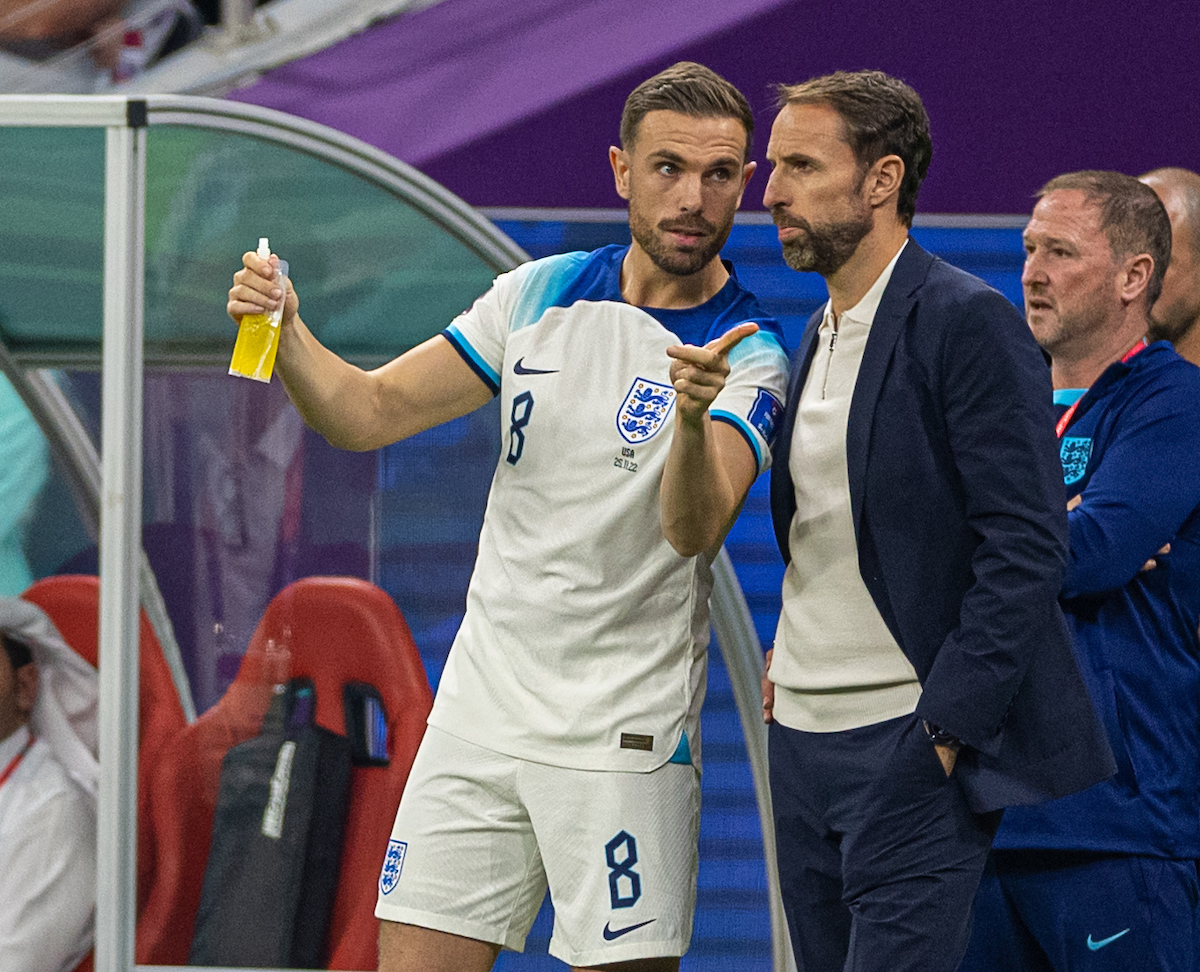 England's Jordan Henderson (L) speaks with manager Gareth Southgate as he comes on as a substitute during the FIFA World Cup Qatar 2022 Group B match between England and USA at the Al Bayt Stadium